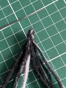 dreads felted together to make a custom Sleep Token figurine