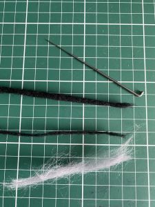 black and grey wool to make a custom Sleep Token figurine