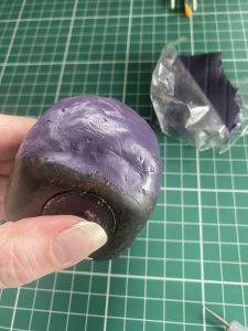 clay applied to head used to make custom Sleep Token figurine