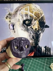 finished head next to the image for a custom Sleep Token figurine