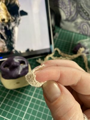 lace wrapped around finger to create texture on a custom Sleep Token figurine