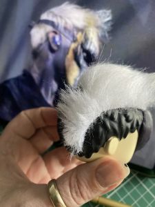 white fur stuck to a figure head to make a custom Sleep Token figurine