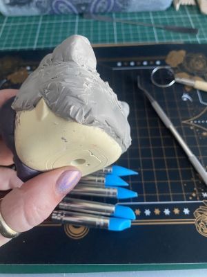 sculpting iii's hair on a custom Sleep Token figurine