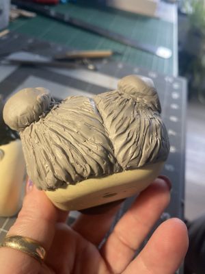 sculpting iii's hair on a custom Sleep Token figurine