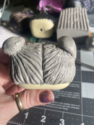 sculpting iii's hair on a custom Sleep Token figurine