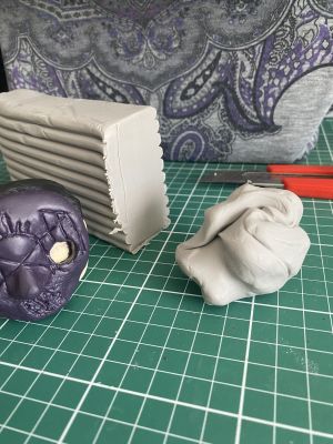 sculpting iii's hair on a custom Sleep Token figurine