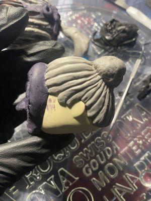 sculpting iii's hair on a custom Sleep Token figurine