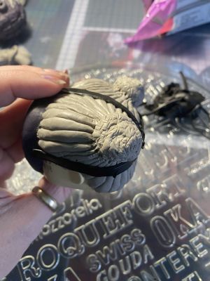 sculpting iii's hair on a custom Sleep Token figurine