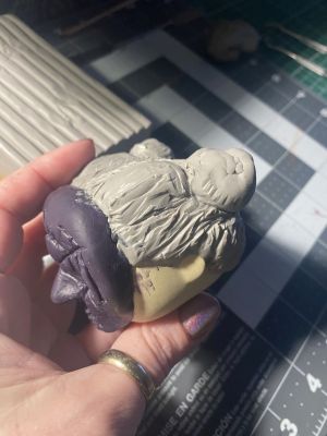 sculpting iii's hair on a custom Sleep Token figurine