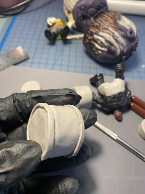 covering foil drum forms with clay for custom Sleep Token figurine