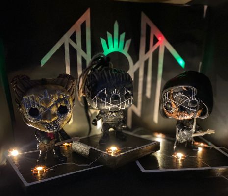 Altered Vessels on a stage. customised pop vinyl figurines of ii, iii and iv